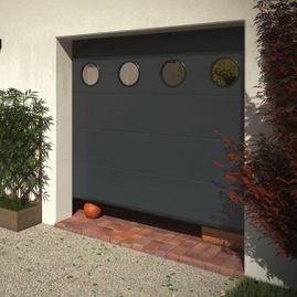 porte de garage noire avec hublots